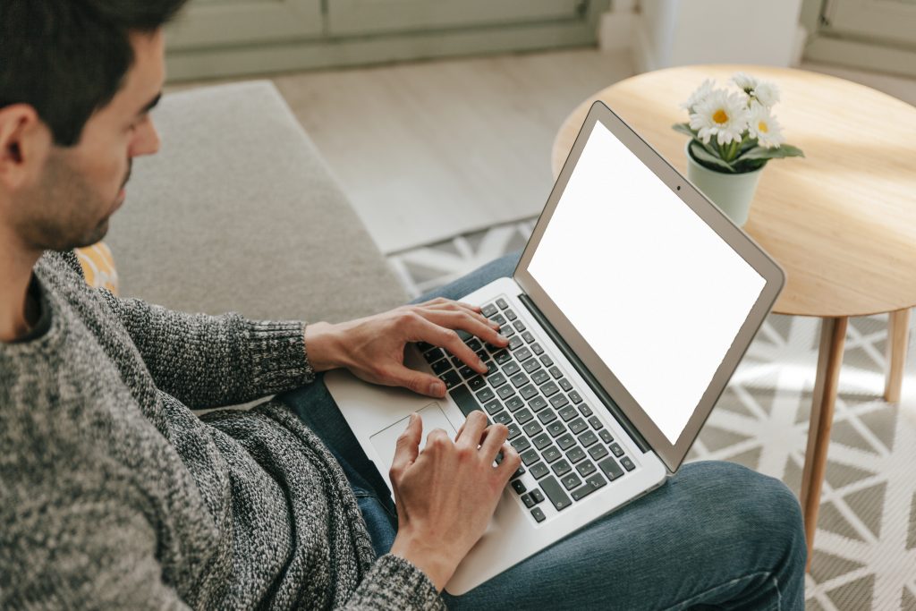 man-using-laptop-sofa Entrepreneurial Resilience: Charting a Financial Comeback After Addiction